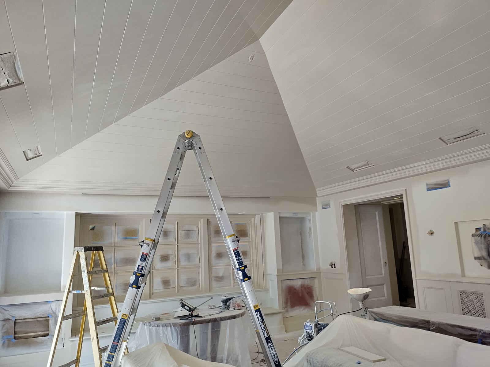 Vaulted shiplap ceiling wearing a crisp new coat of paint